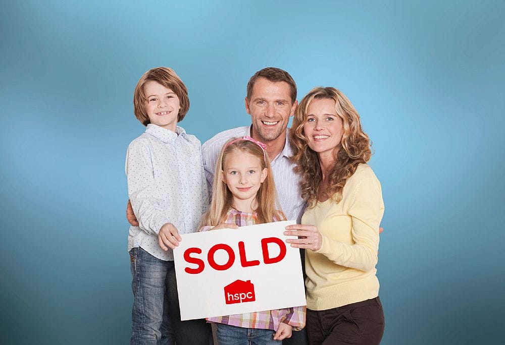 a group of people holding a sign